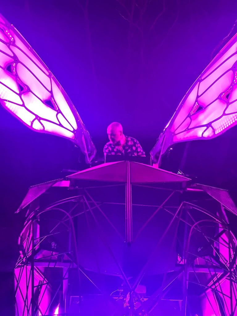 Howie Bounce performing with butterfly wings at The Jingle event.